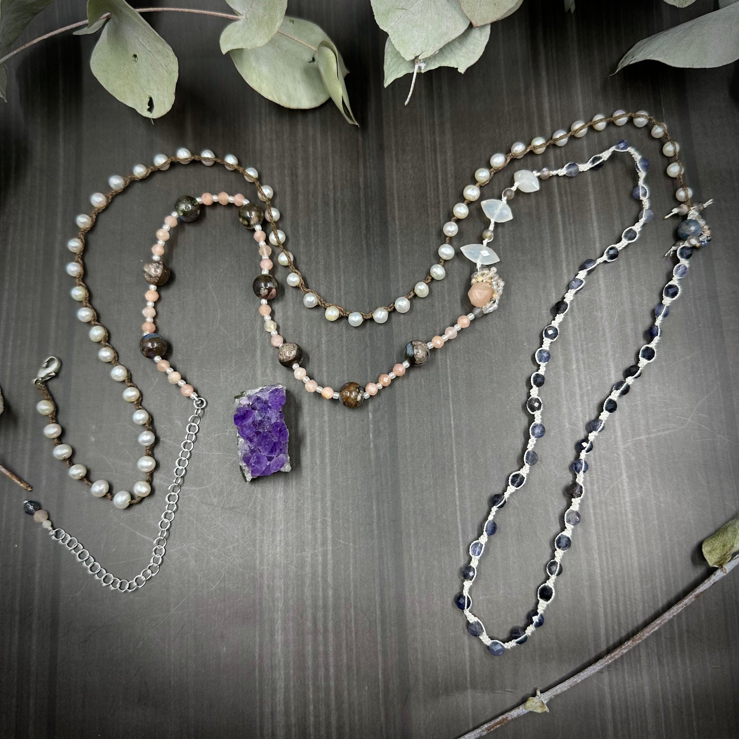 Incredibly intricate knotted and strung wrap piece with moonstone, iolite, sapphire, pearl, and more