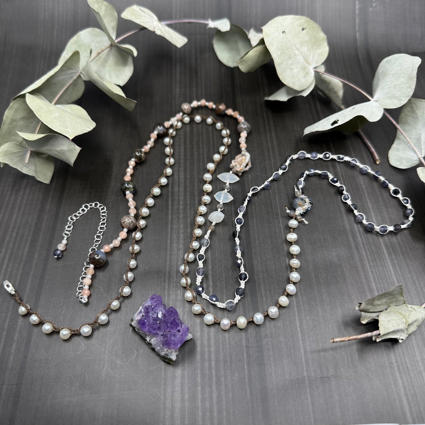 Incredibly intricate knotted and strung wrap piece with moonstone, iolite, sapphire, pearl, and more