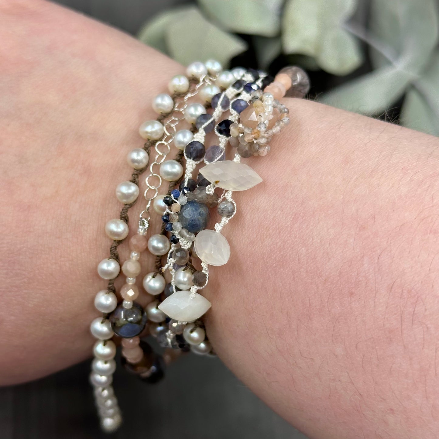 Incredibly intricate knotted and strung wrap piece with moonstone, iolite, sapphire, pearl, and more