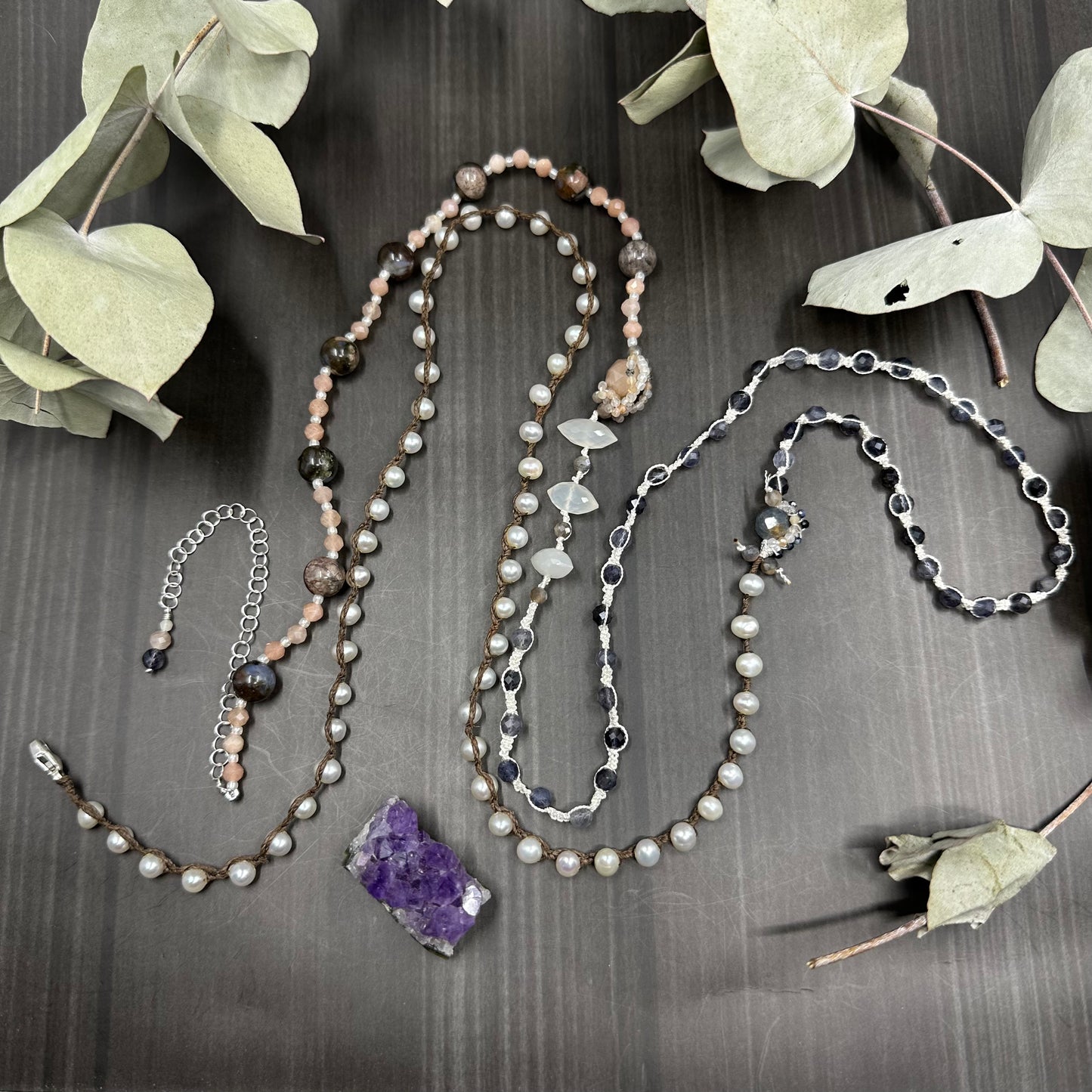 Incredibly intricate knotted and strung wrap piece with moonstone, iolite, sapphire, pearl, and more
