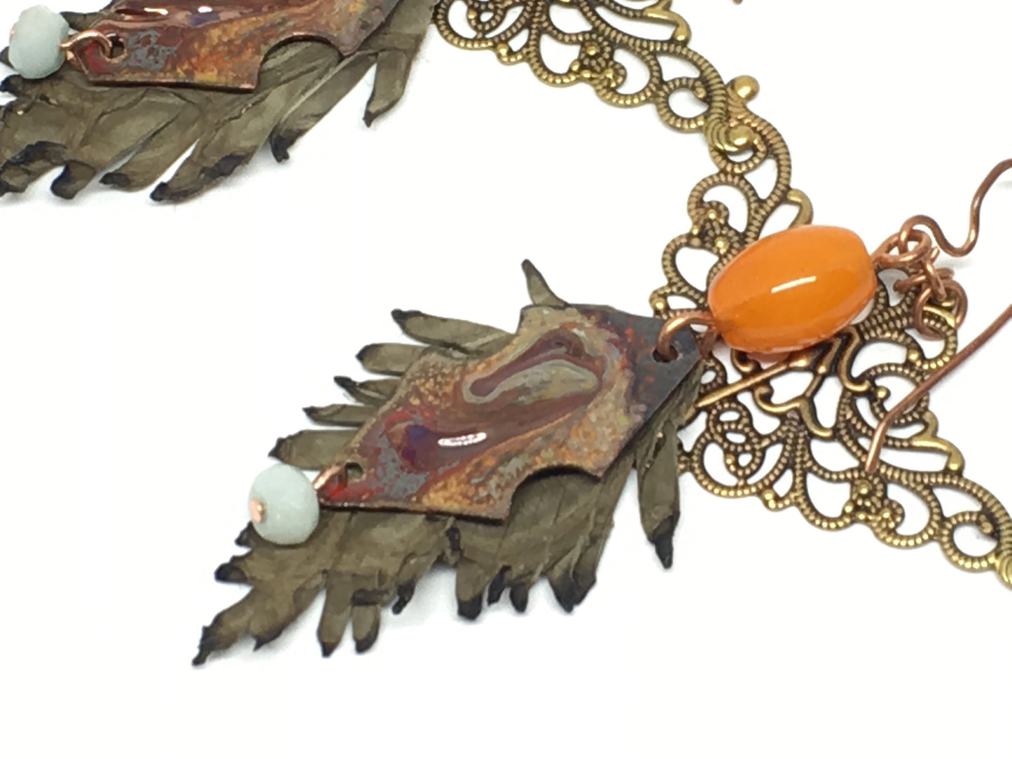 Leather feathers with vintage elements and Artisan Enamel