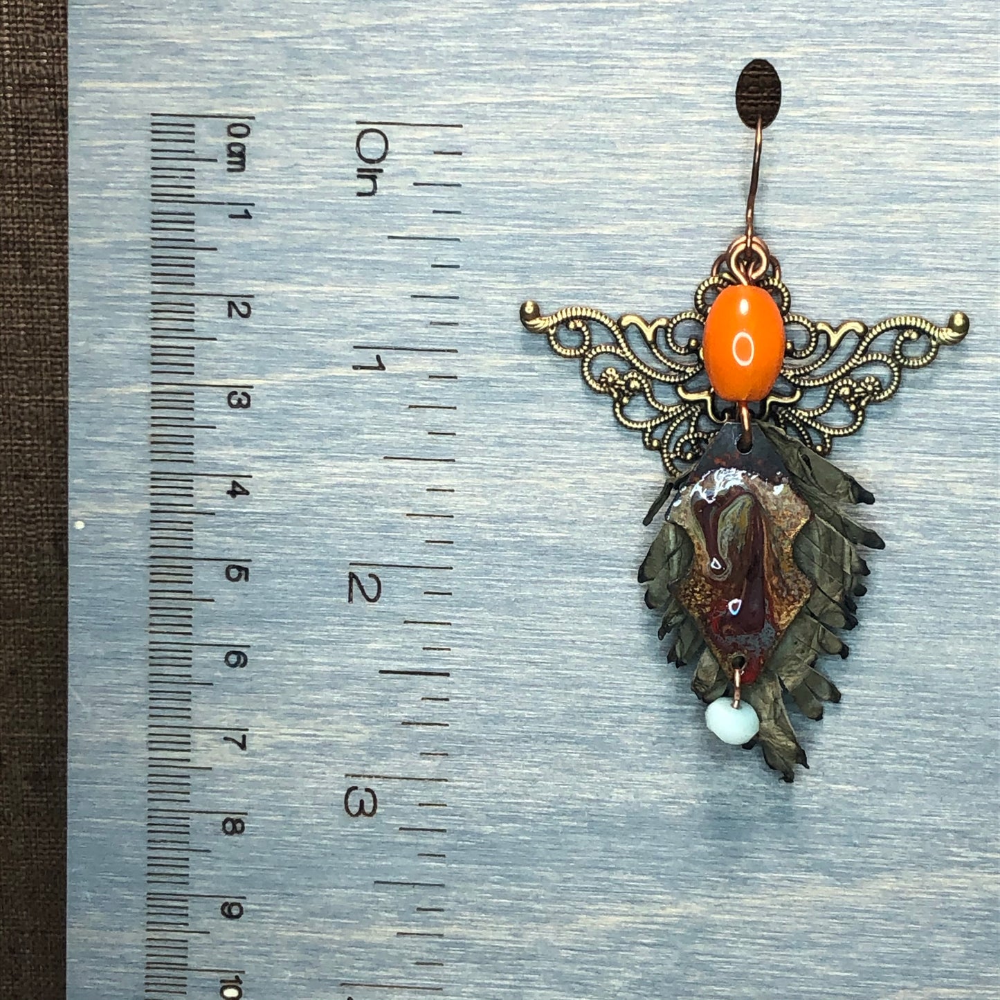 Leather feathers with vintage elements and Artisan Enamel