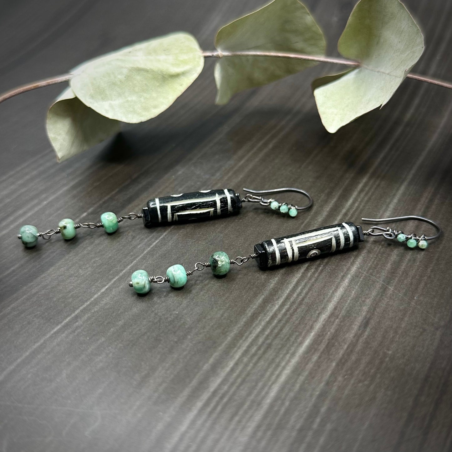 Carved Bone Earrings with Black Spinel and Emeralds