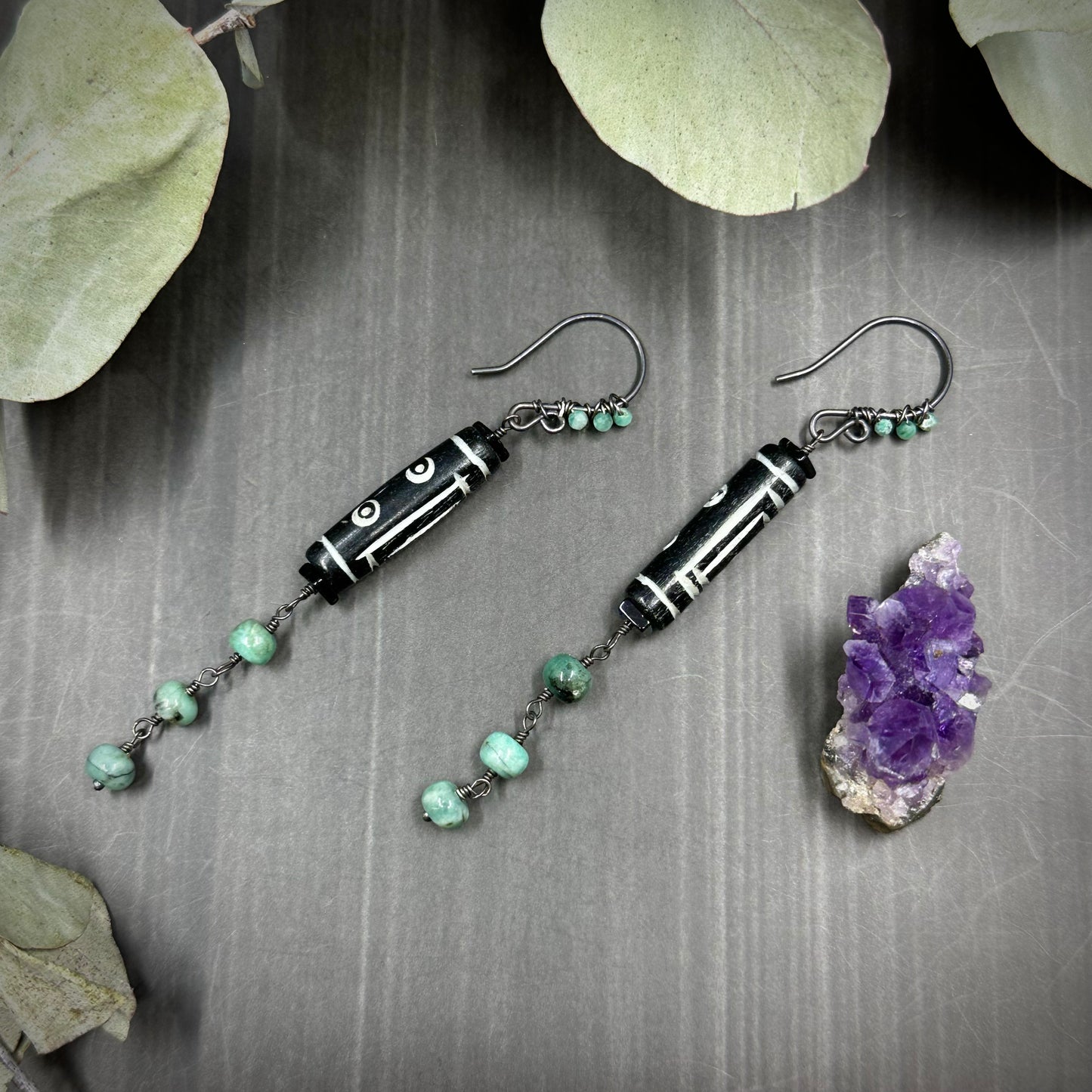 Carved Bone Earrings with Black Spinel and Emeralds