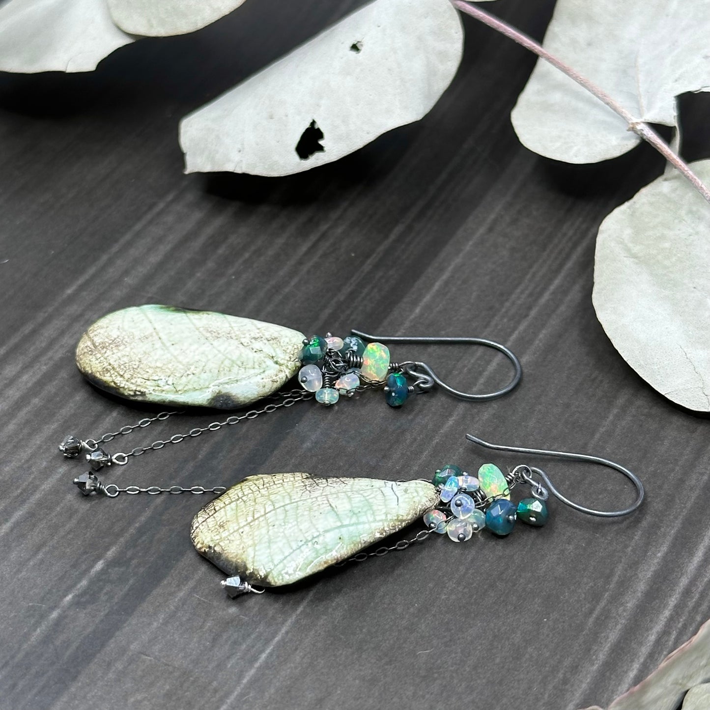 Wing and opal earrings in sterling silver