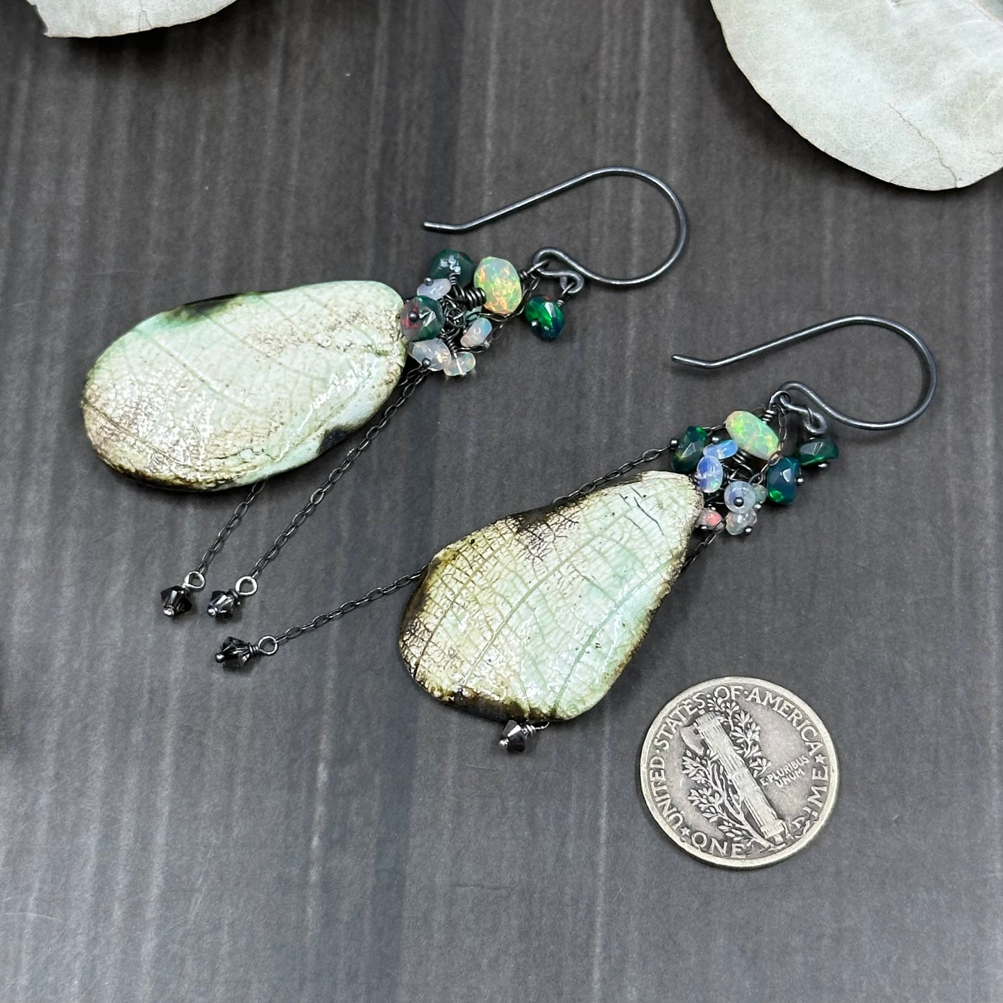 Wing and opal earrings in sterling silver